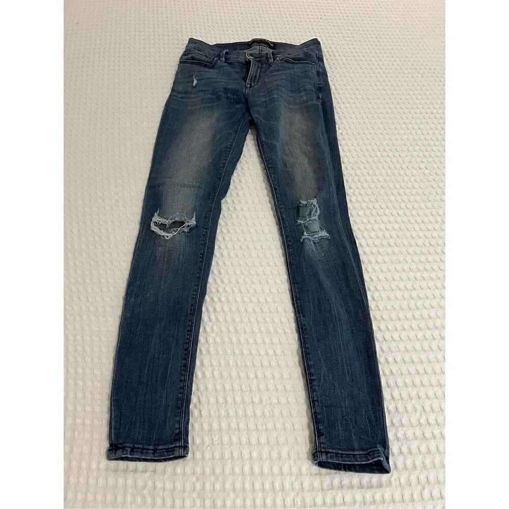 Express jeans mid rise legging skinny blue jeans with holes size 4